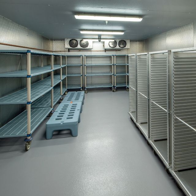 Why Invest in a Custom Walk In Refrigerator for Your Restaurant 2 empty storage and shelves